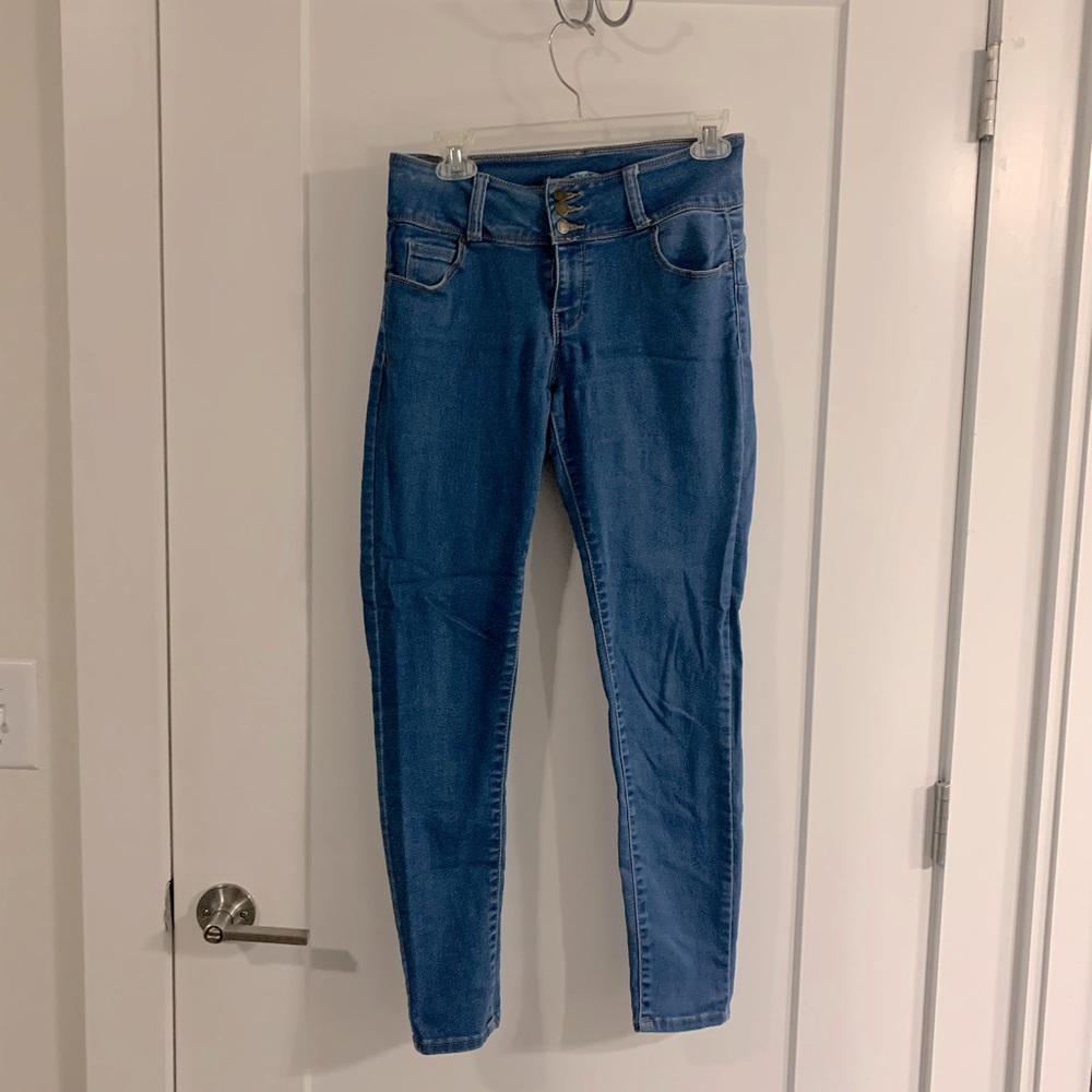 Size 9 lights blue booty enhancing jeans with stretch from Wax Jean